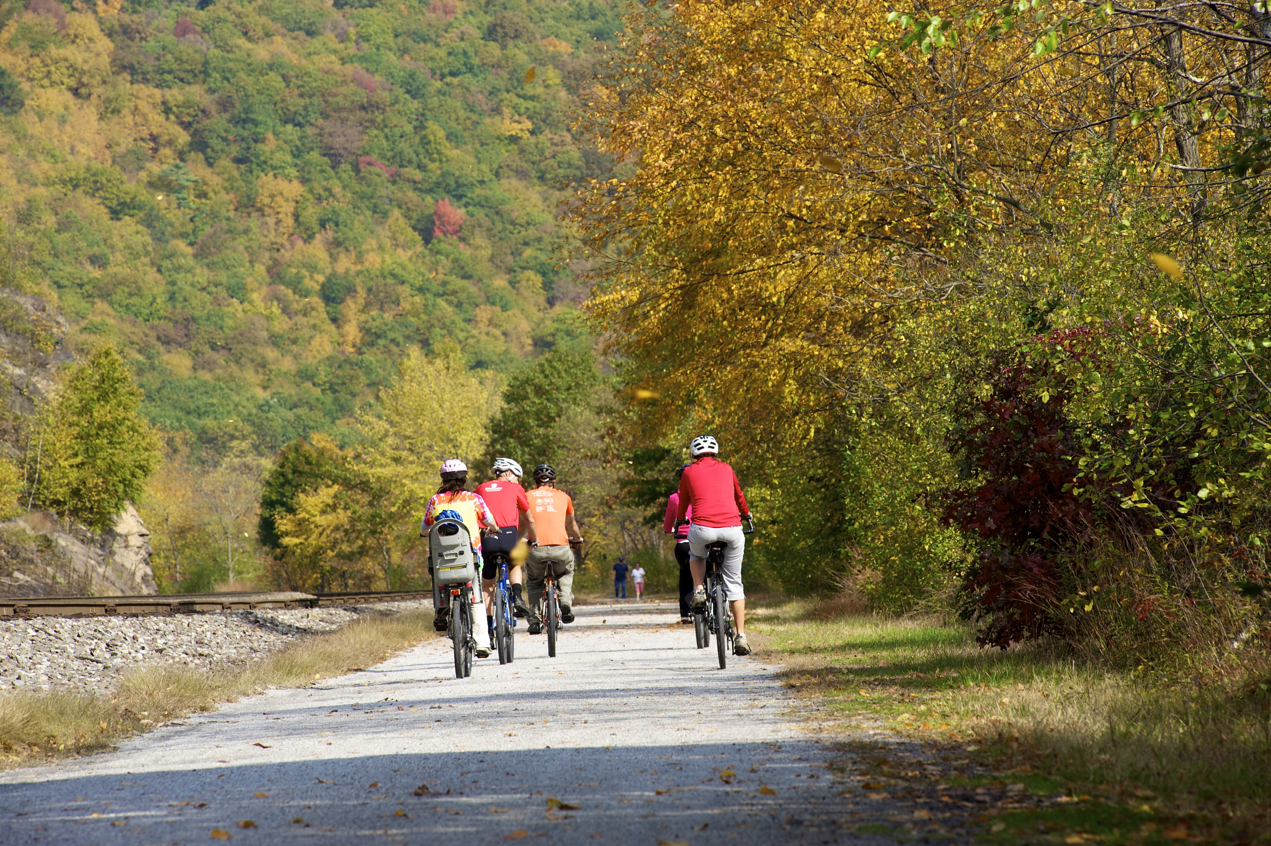 A family biking in the fall.