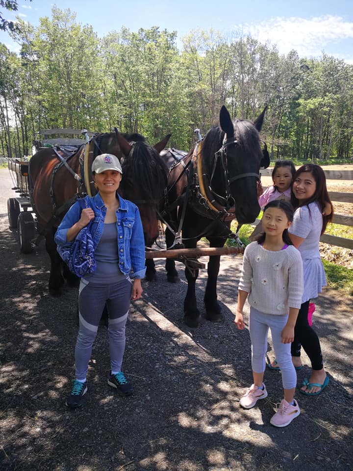Family in Front of Wagon Horses